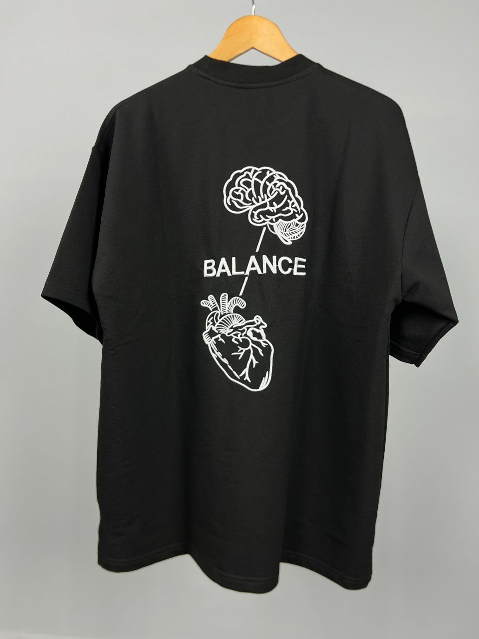 Head & Heart T-Shirt Black – Back view with embroidered brain and heart
