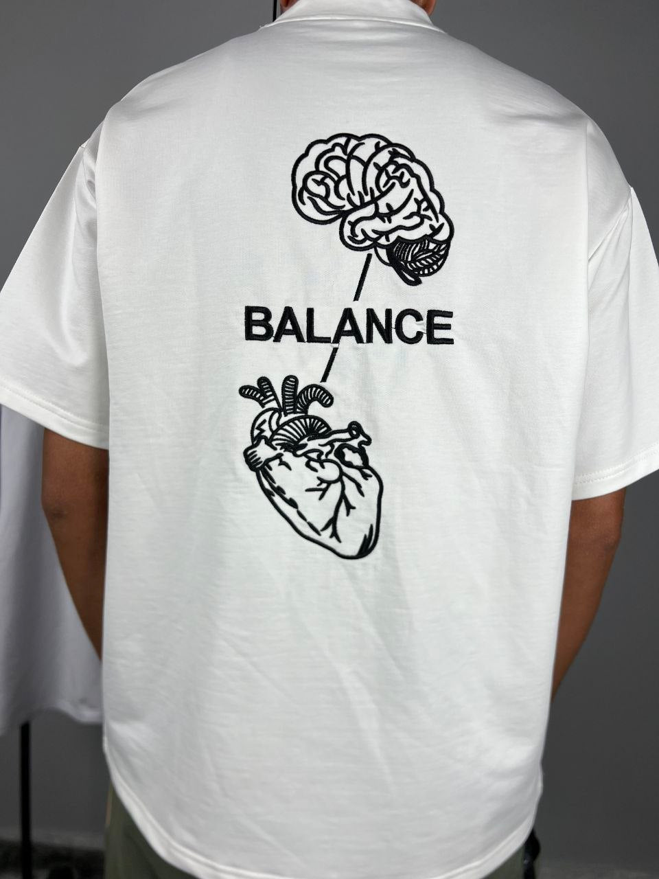 Head & Heart T-Shirt White – Back view with embroidered brain and heart