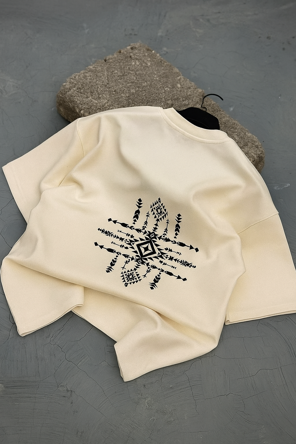 Bladestorm T-Shirt Off-White – Back flat lay with geometric embroidery